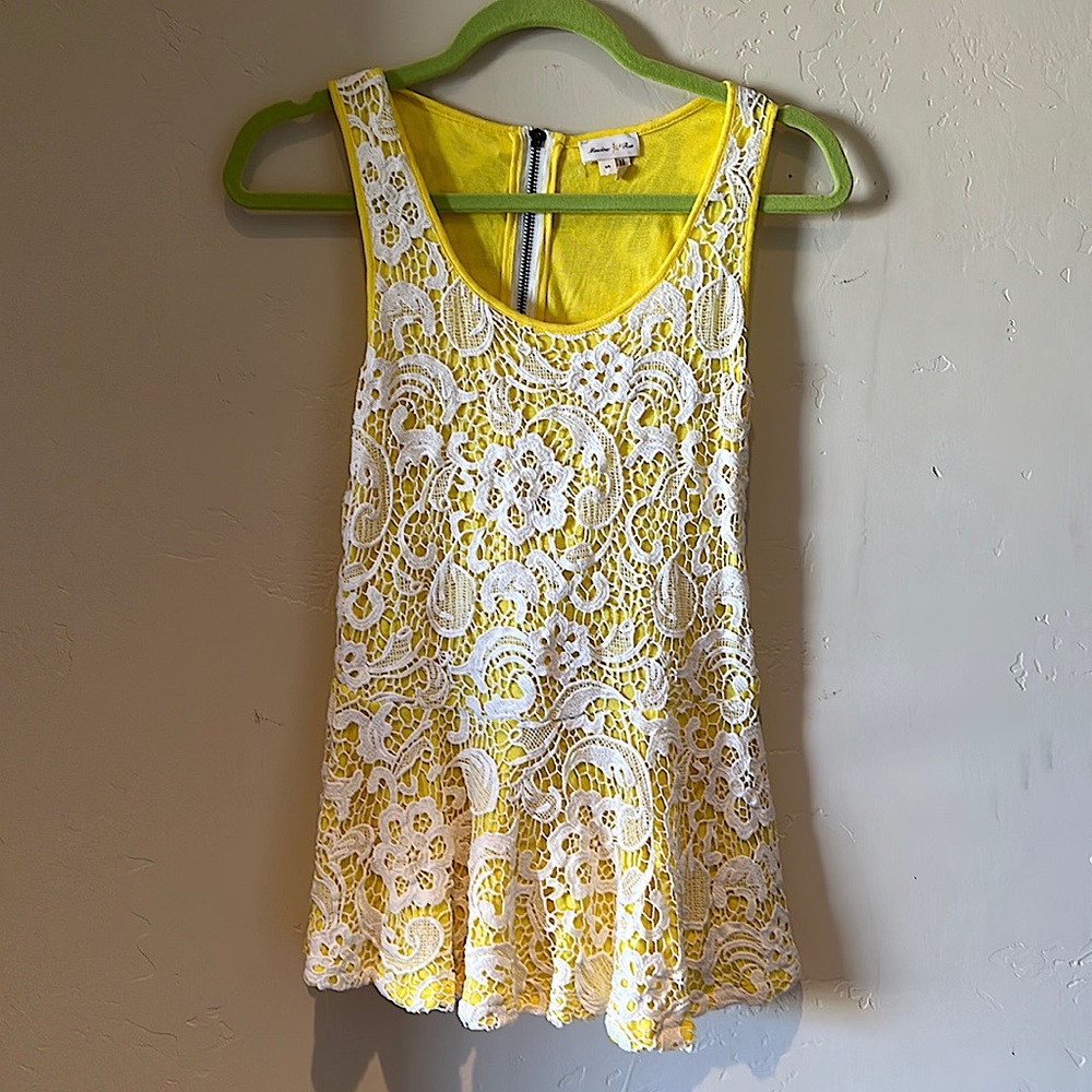 Adorable yellow peplum tank with white lace overlay